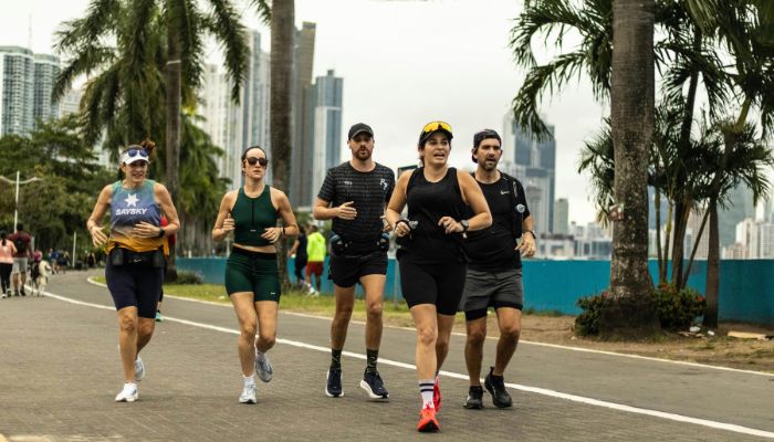 Group of runners exercising together on an outdoor path