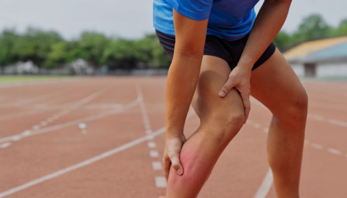 Runner holding a sore leg