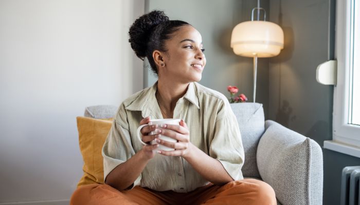 Woman sitting feeling relaxed 