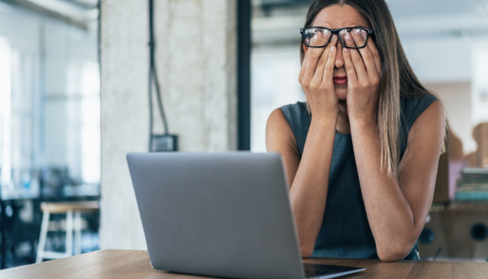 Woman experiencing brain fog while working