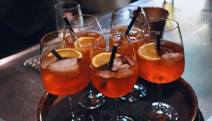 cocktails with citrus slices on a serving tray