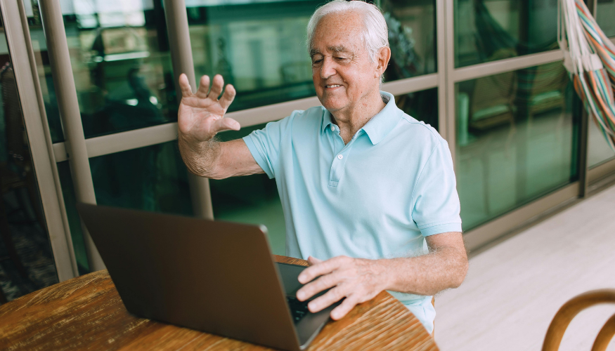 Senior man smiling during a video call